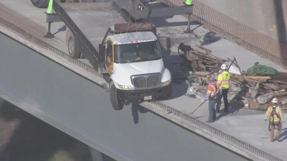 Truck hangs from flyover in Fort Bend County