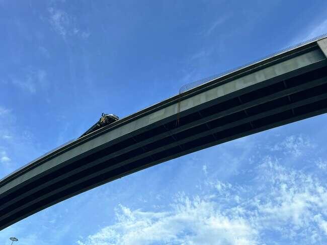 Dramatic footage shows truck hanging off Houston-area flyover bridge