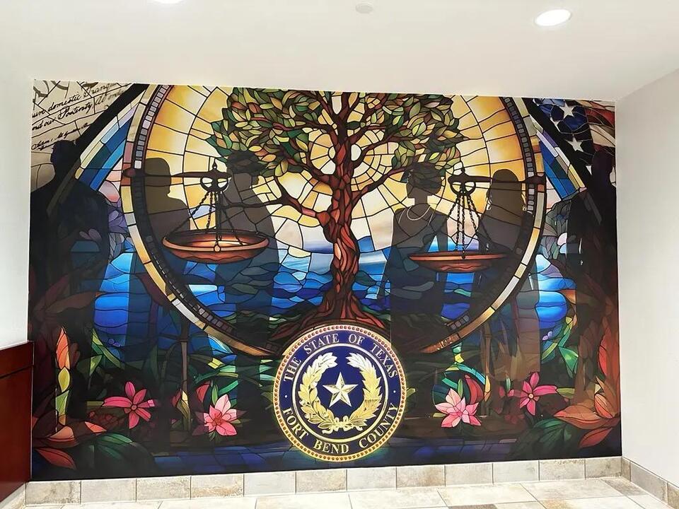 Fort Bend District Attorney’s office unveils mural designed by area high schoolers and artist Reginald Adams